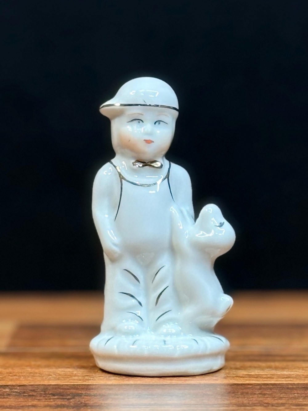 Little Boy with Dog Figurine
